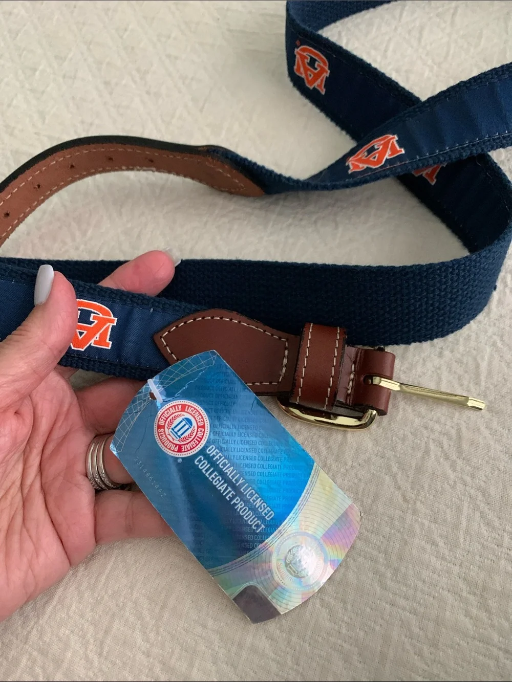Navy Web Belt with Orange Logo Accents and Brown Leather Trim